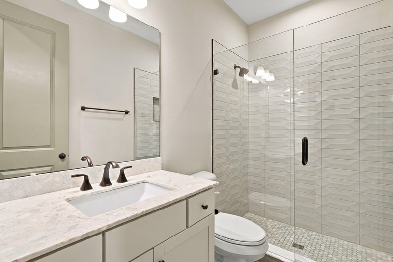 Bathroom vanity with quartz countertop at 3921 Spyglass Hill Ln