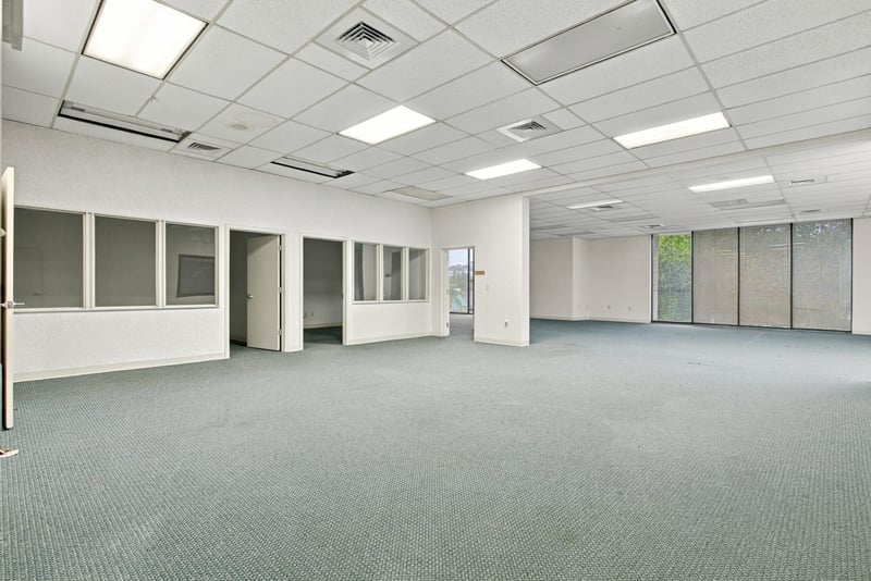 Open office space with partition walls at 101 Scholars Wy