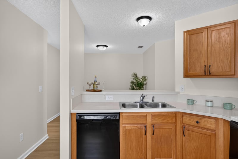 Kitchen sink and stove with white countertops at 605 N Covered Bridge Rd, Jacksonville, FL