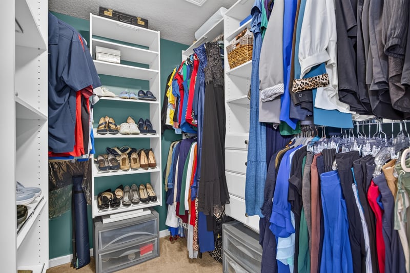 Primary walk-in closet with built-in shelving at 3112 Silverado Cir, Green Cove Springs, FL 32043