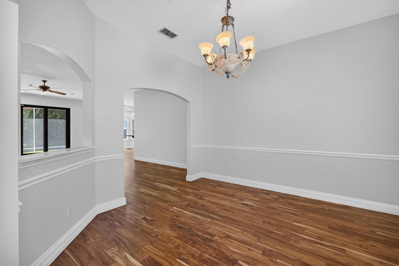 Formal room with chandelier and wood floors at 11675 Magnolia Estates Rd, Jacksonville, FL 32223