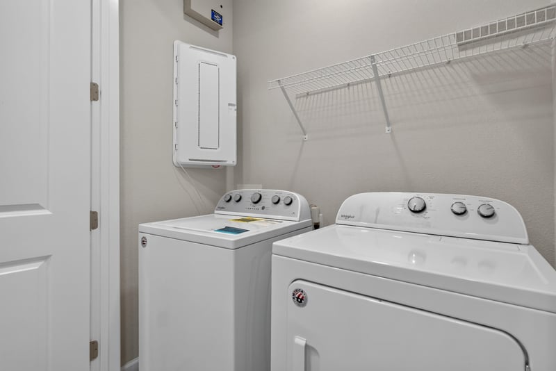Laundry closet with washer and dryer at 7446 Loggerhead Ct, Jacksonville, FL 32256