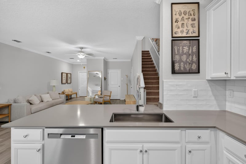 Kitchen and stairs from the loft at 1186 Beach Dune Dr, Jacksonville, FL 32233
