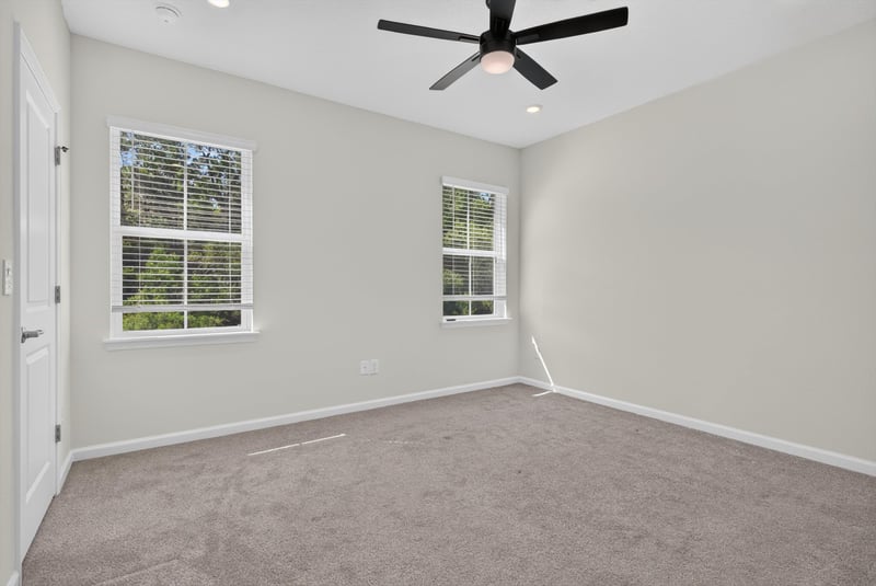 Carpeted bedroom with ceiling fan at 39 Mellowood Ln, St. Augustine, FL 32092