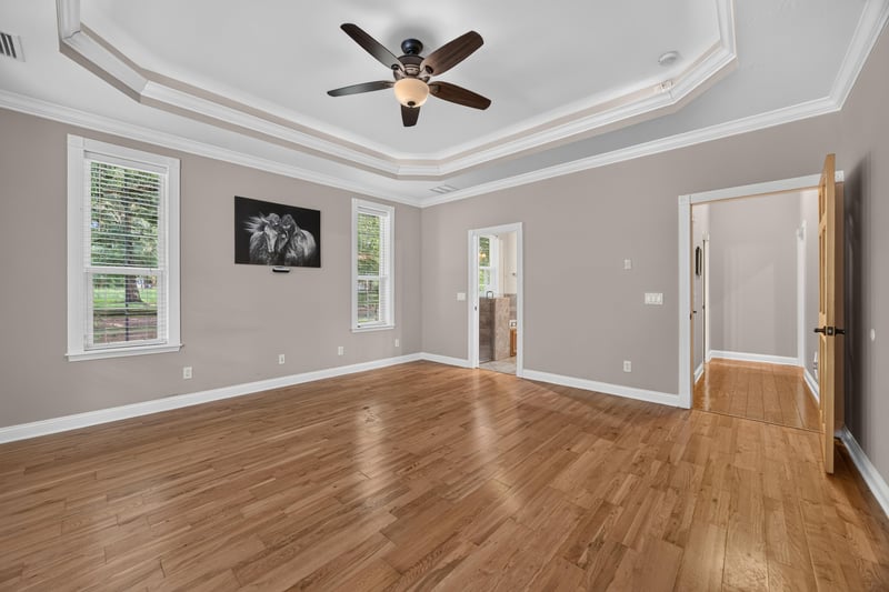 Primary bedroom with wall-mounted television at 1735 Hagans Ridge Ct