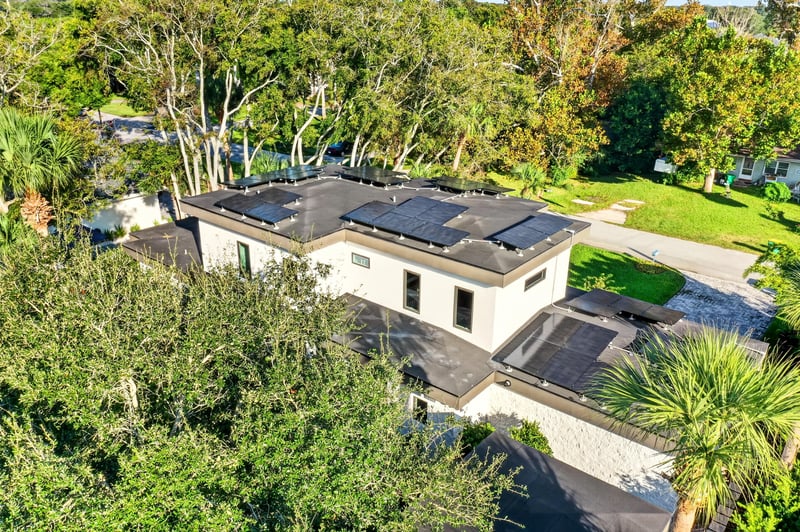 Aerial view of the home surrounded by tree canopy at 722 3rd Ave N, Jacksonville Beach, FL