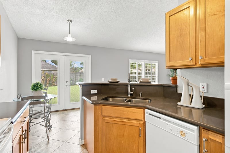 Kitchen and dining area with french doors at 11197 Illford Dr