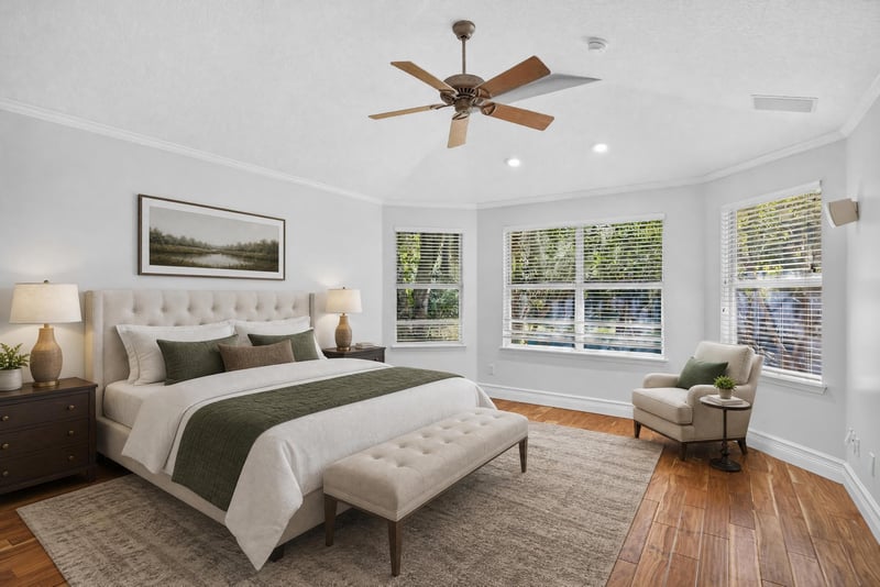 Primary bedroom with bay window and wood floors at 11675 Magnolia Estates Rd, Jacksonville, FL 32223