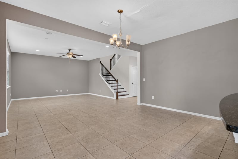 Family room with staircase and chandelier at 263 Gilmore Ln, Orange Park, FL 32065
