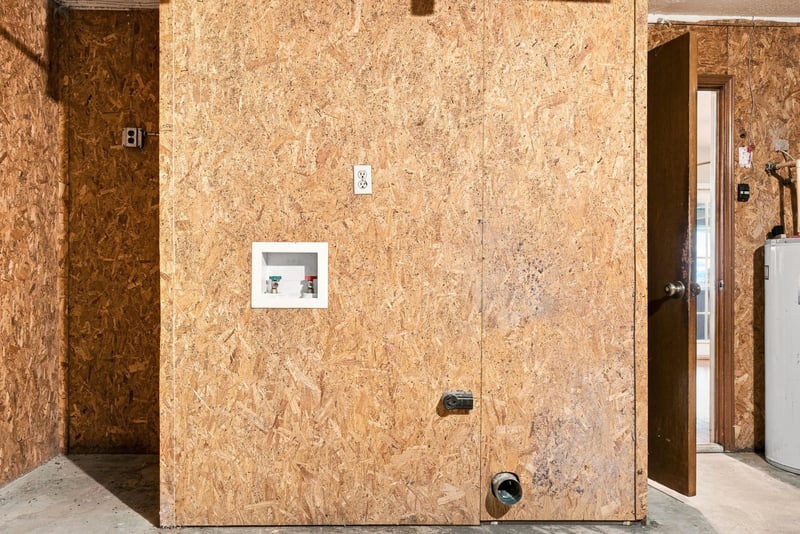 Unfinished utility room with plywood walls at 2915 Trenton Ct, Orange Park, FL