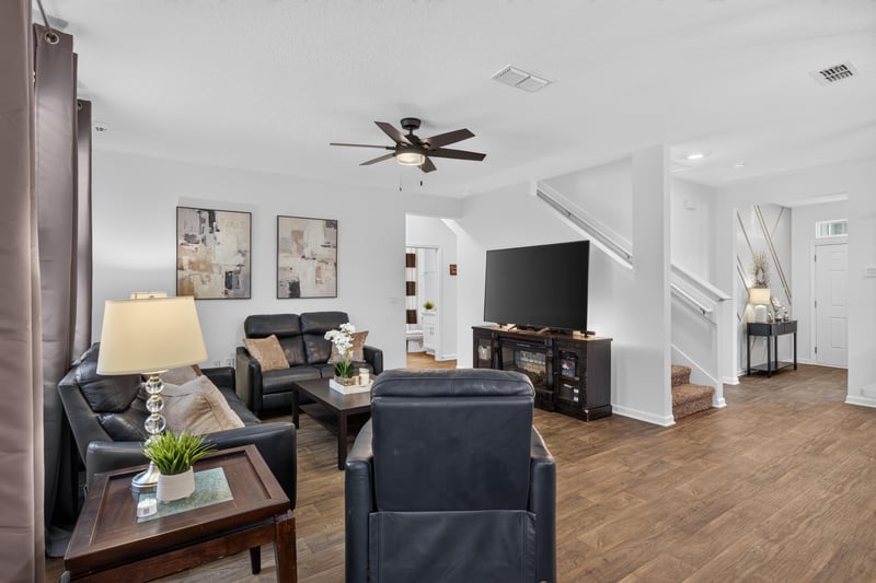 Living room view toward staircase and entry at 65255 Frst Glen Ln, Yulee, FL 32097