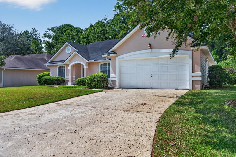 Front exterior and driveway toward garage at 9256 Dale View Ln W, Jacksonville, FL 32225
