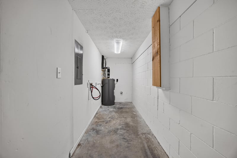 Utility hallway with water heater and electrical panel at 1143 Tumbleweed Dr, Orange Park, FL 32065