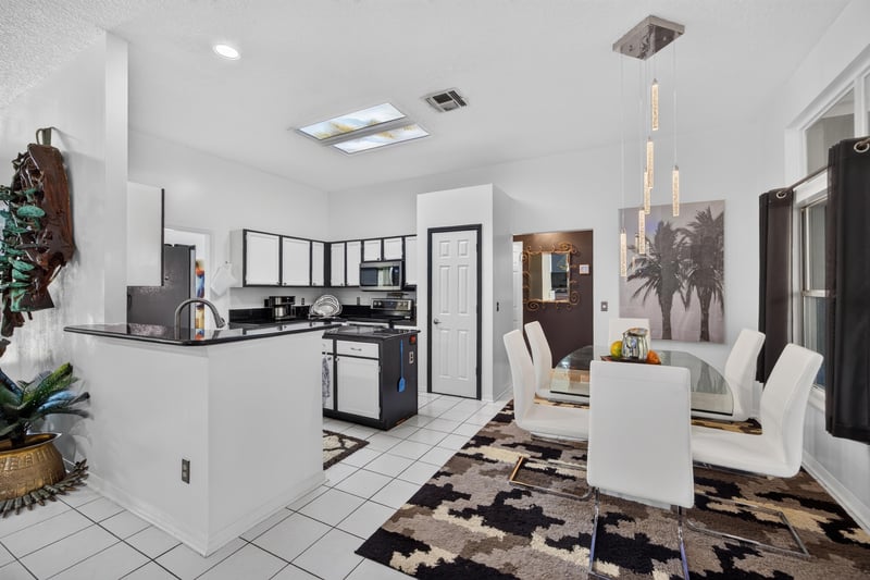 Kitchen with tile flooring and dark cabinetry at 1346 Gately Ct, Jacksonville, FL 32225