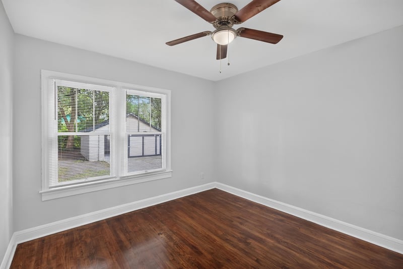 Bedroom with windows and ceiling fan at 316 W 41st St, Jacksonville, FL 32206