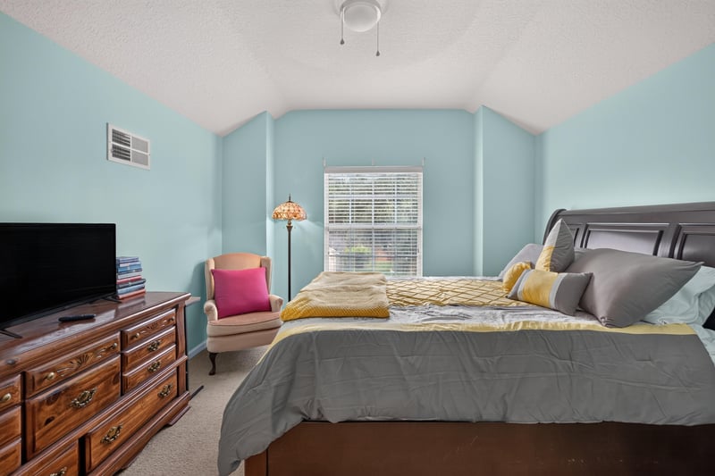 Bedroom with dresser and natural light at 3112 Silverado Cir, Green Cove Springs, FL 32043