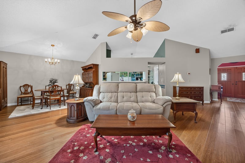 Living room with sofa and dining table at 4837 Pareja Ct, Jacksonville, FL 32225