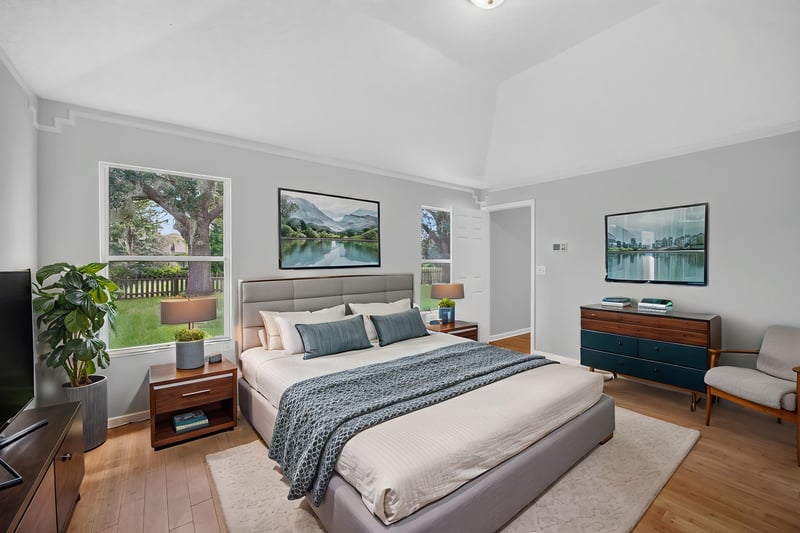 Bedroom with staged bed and windows at 456 Bay Point Way N, Jacksonville, FL 32259