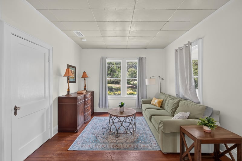 Living room with sofa and dresser at 101 N Lake St, Crescent City, FL