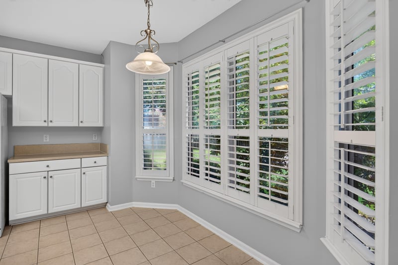 Kitchen corner with white cabinets, tile floor at 470 Sparrow Branch Cir, Jacksonville, FL 32259