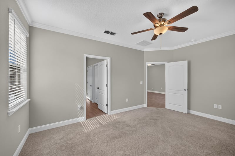 Bedroom with carpet and double doors at 331 Millerstone Dr, St. Augustine, FL 32092