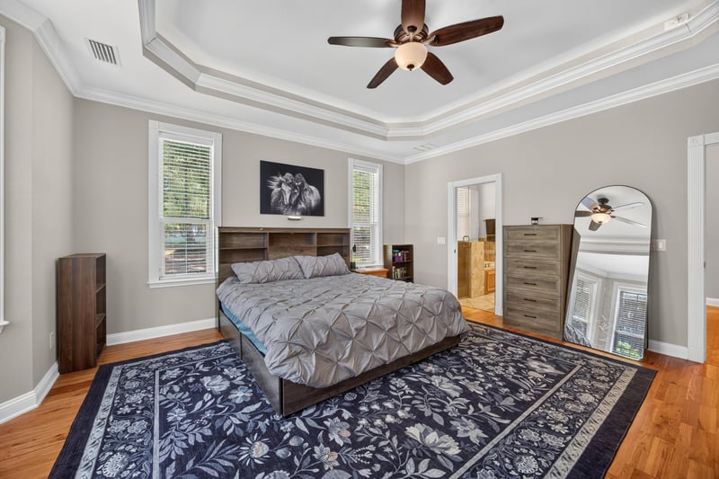 Primary bedroom with dresser and mirror at 1735 Hagans Ridge Ct