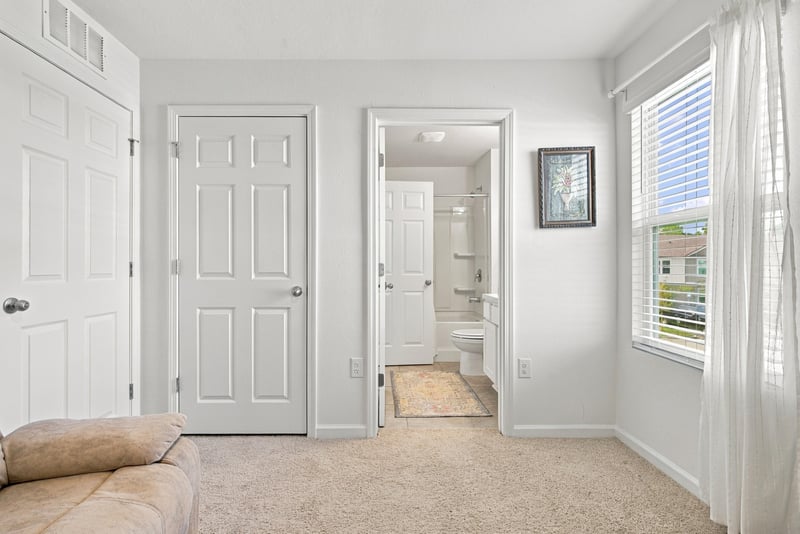 Hallway with carpet and multiple doors at 8359 Zenith Cir, Jacksonville, FL 32256