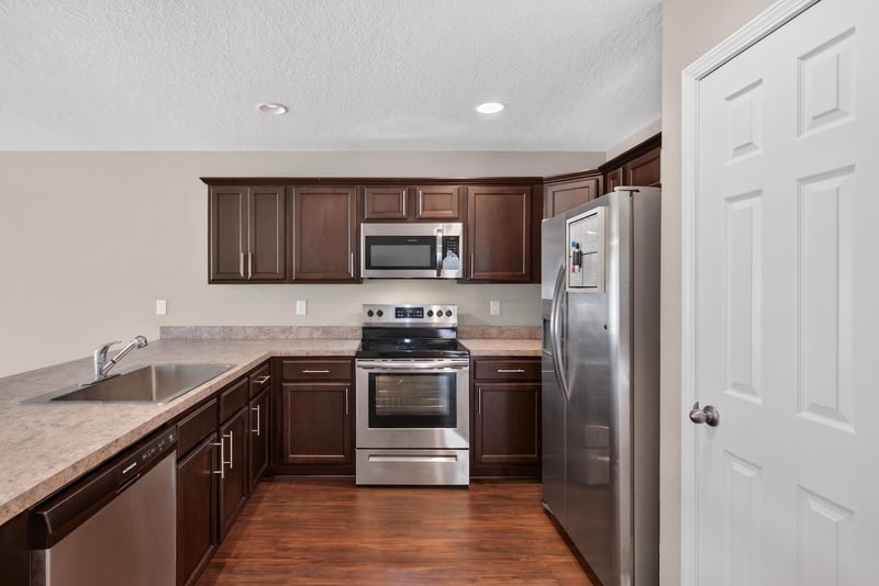Kitchen sink area with stainless refrigerator at 7253 Townsend Village Ct, Jacksonville, FL