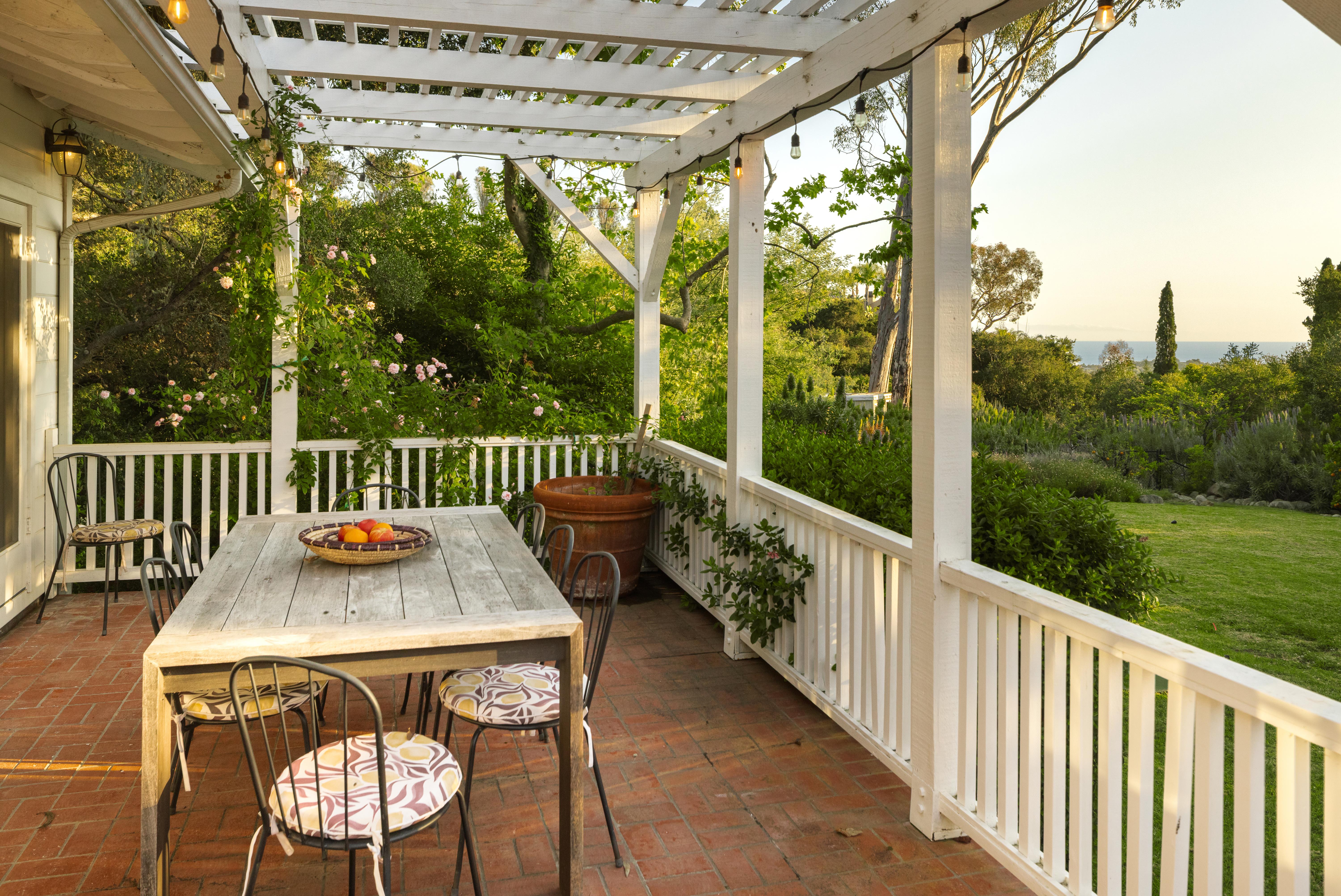 Professional real estate photography of the primary suite and private outdoor spaces at 2915 Hidden Valley Ln, Santa Barbara — golden hour illuminates the interplay of indoor and outdoor living along the Santa Barbara Riviera. Our team captured still photography, aerial drone photography, and twilight photography from late afternoon through twilight.