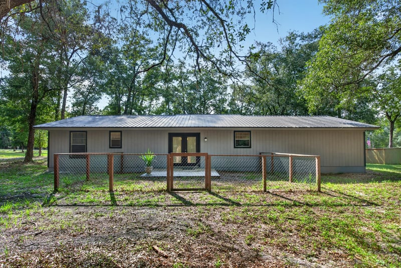 Backyard with fenced run and view of rear exterior at 2829 Blackberry Ave