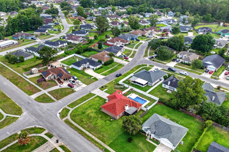 Aerial view of neighborhood rooftops and streets in Middleburg, FL