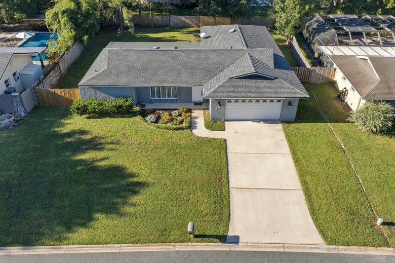 Drone aerial view of the home and driveway, photographed by Megapixeler on Crosby Ln, Orange Park