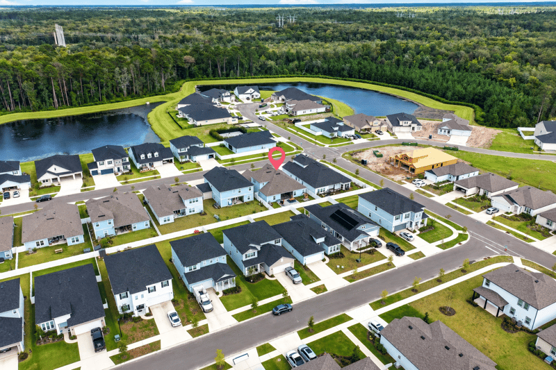 Aerial view of the neighborhood pond and streets in Middleburg, FL