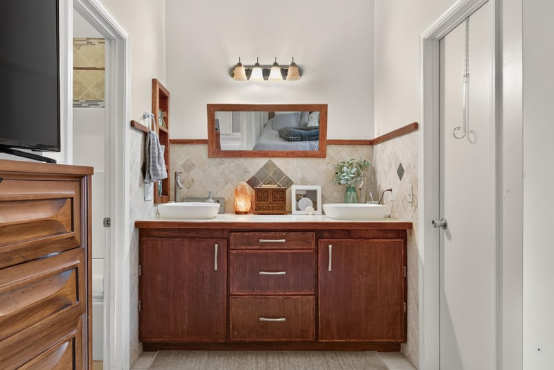 Bathroom vanity with dark wood cabinet at 13020 Medford Ln, Jacksonville, FL 32225