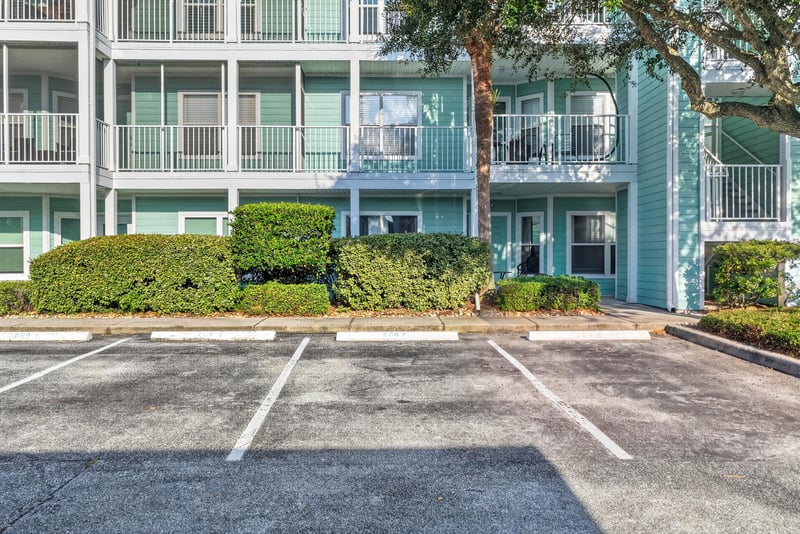 Aerial view of the condo building and parking lot at 206 16th St, St. Augustine, FL 32080