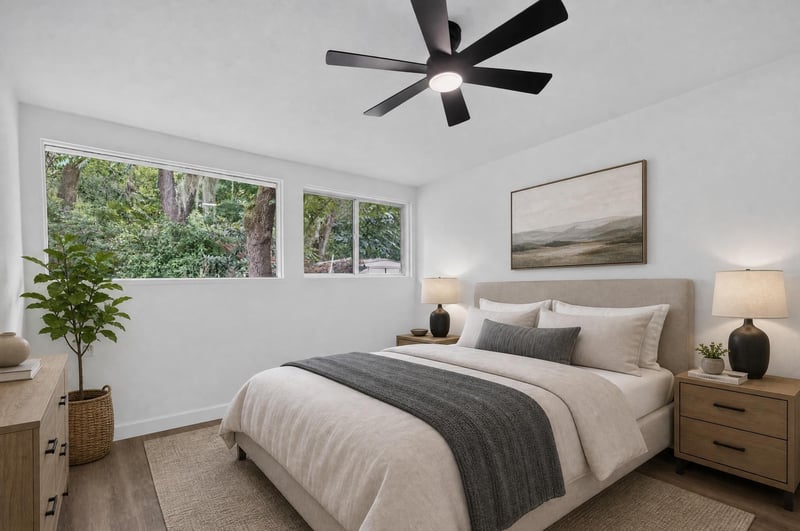 Staged bedroom with bed and windows at 3113 Kline Rd, Jacksonville, FL 32246