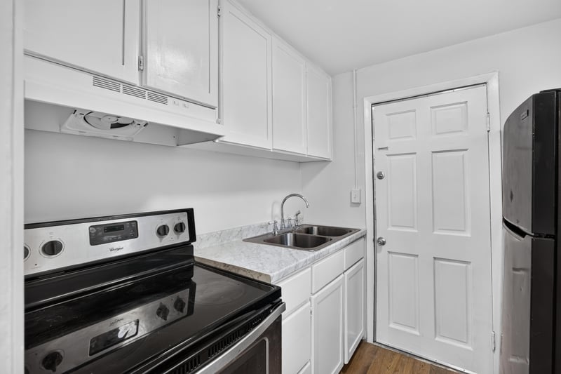 Kitchen stove, sink, and cabinets at 4951 Halls Dr