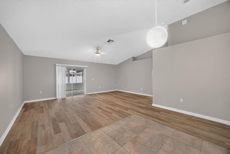 Living space with vaulted ceiling and pendant light at 1845 Saga Ct, Middleburg, FL