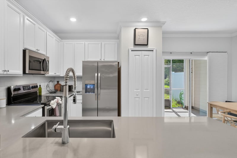 Kitchen sink near sliding glass door at 1186 Beach Dune Dr, Jacksonville, FL 32233