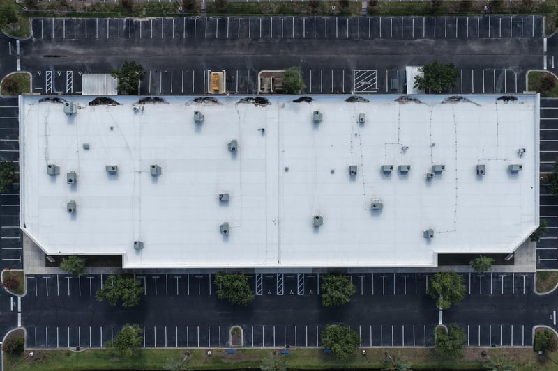 Aerial close-up of a building roof with rooftop equipment at 10550 Deerwood Park Blvd, Jacksonville, FL 32256