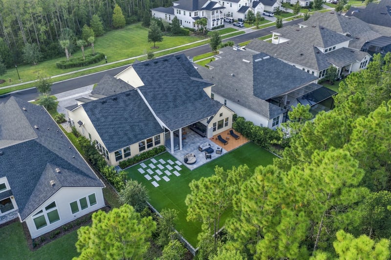 Aerial view of the home with patio and surrounding neighborhood at 907 Seagrove Dr, Ponte Vedra Beach, FL 32081