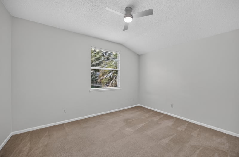 Bedroom with carpet and window at 2480 Ridge Will Dr, Jacksonville, FL 32246