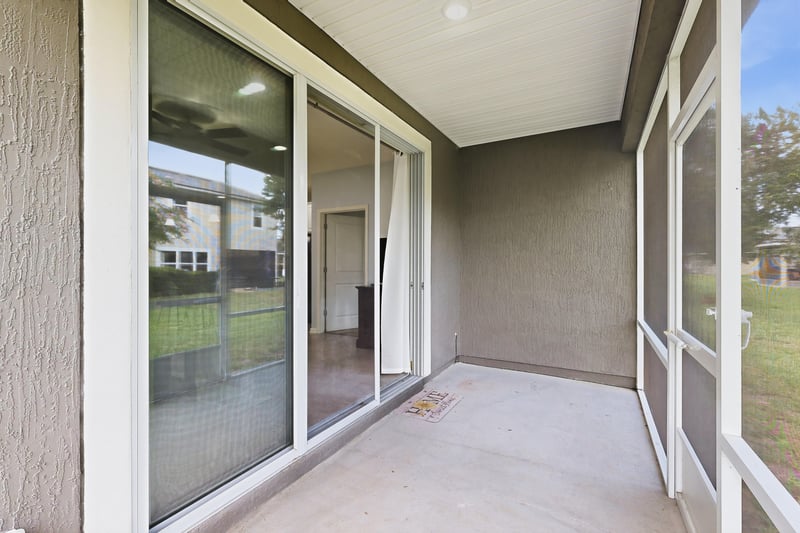 Screened porch with sliding glass door entry at 2378 Caney Oaks Dr, Jacksonville, FL