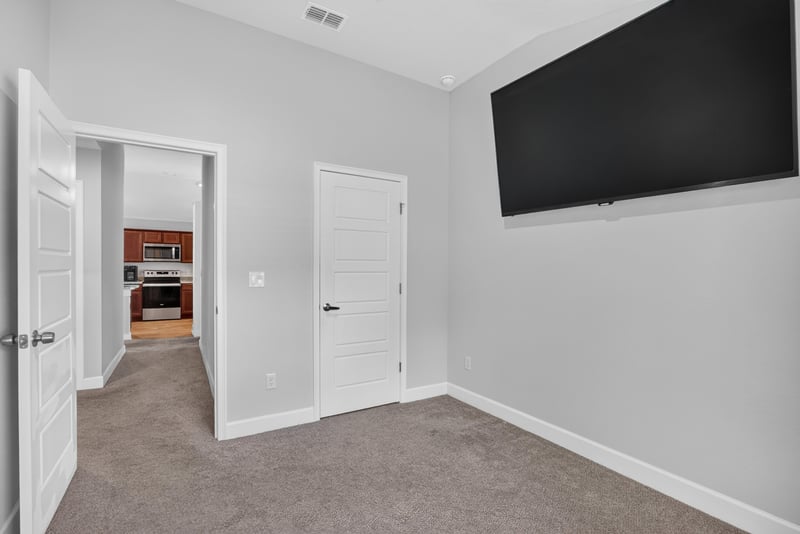 Bedroom with ceiling fan and closet doors at 9846 Olivia St, Jacksonville, FL