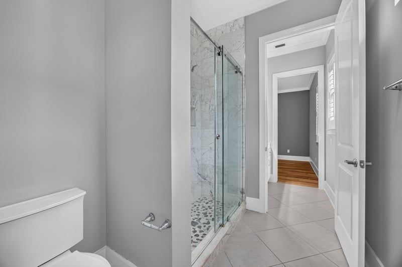 Bathroom with glass-enclosed shower at 186 Freshwater Dr