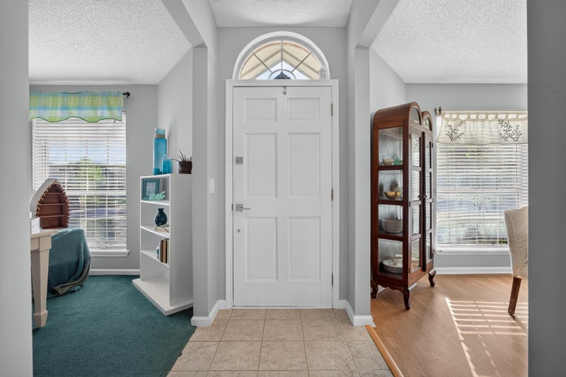 Foyer with arched window door and tile floor at 4556 Shaky Leaf Ln N, Jacksonville, FL 32224