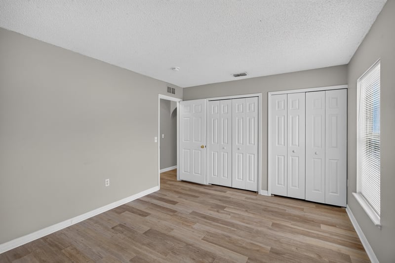 Bedroom with double closets at 1845 Saga Ct, Middleburg, FL