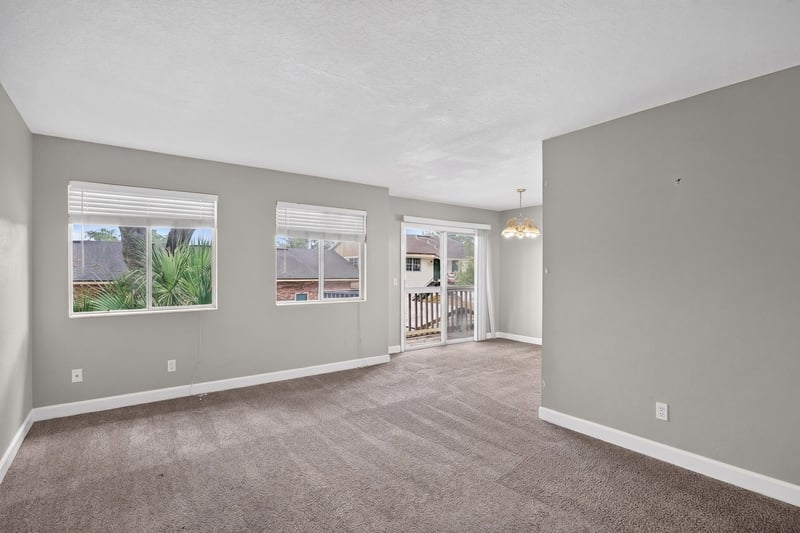 Living room with sliding door to balcony at 1800 Park Ave apt 358, Orange Park, FL