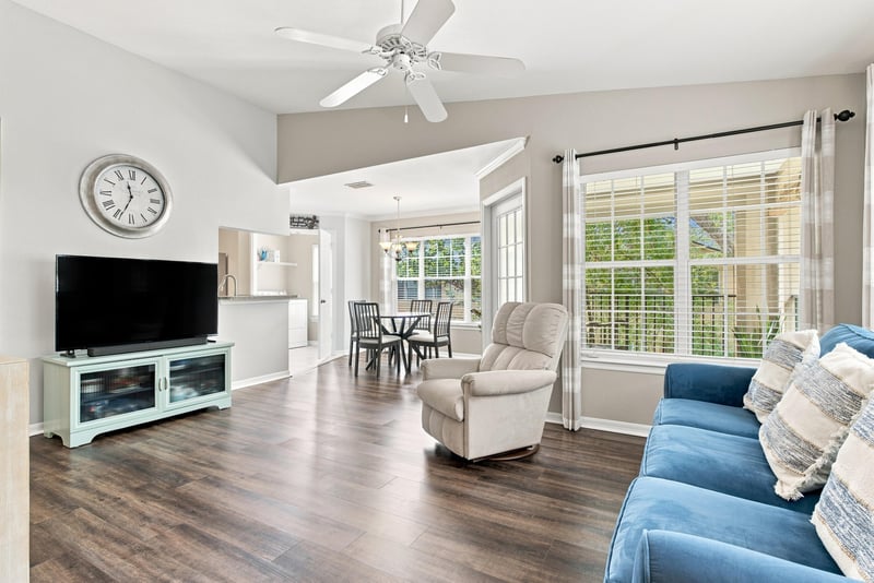 Living room with TV stand and dining table at 7800 Point Meadows Dr, Jacksonville, FL 32256