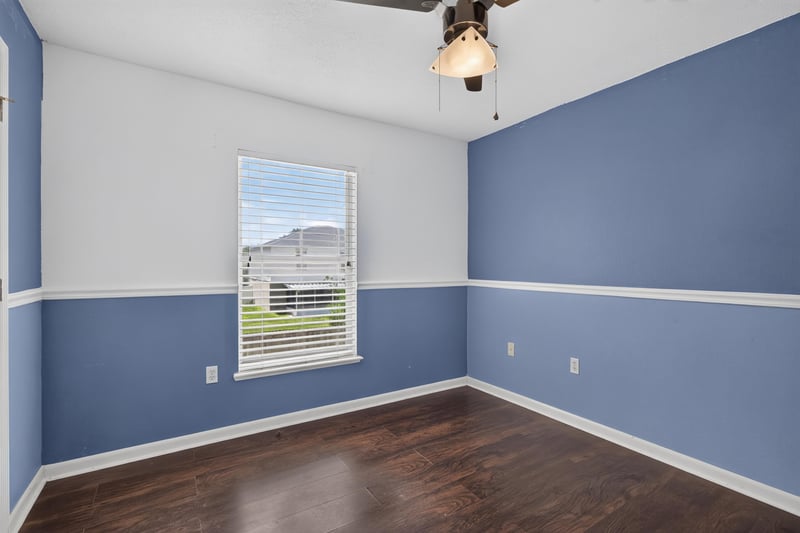 Bedroom with periwinkle two-tone walls at 3428 Glenn Hollow Ct, Jacksonville, FL 32226